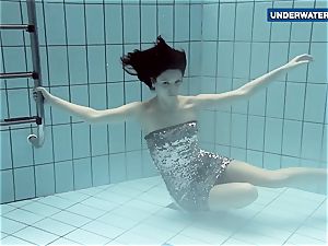 showcasing bright milk cans underwater makes everyone insatiable