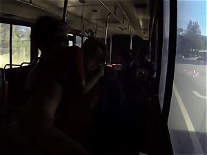 Karmen Bella drills her guy on a crowded bus